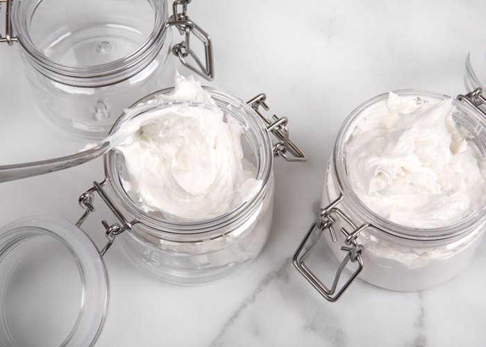 scooping body butter into jars | bramble berry